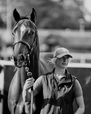 Poppy Barrot leading a horse